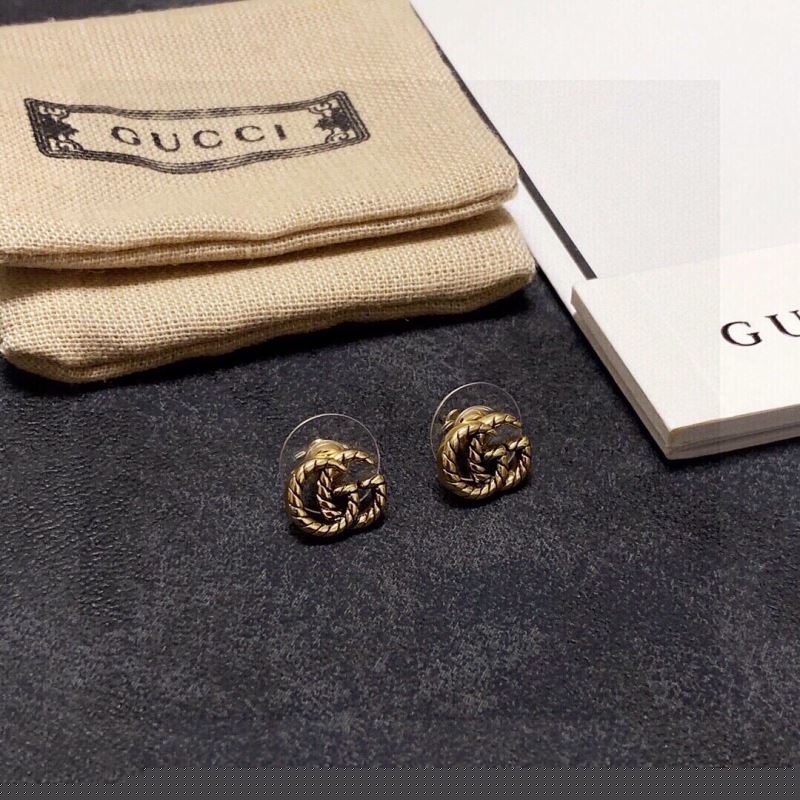 G*u*i earrings